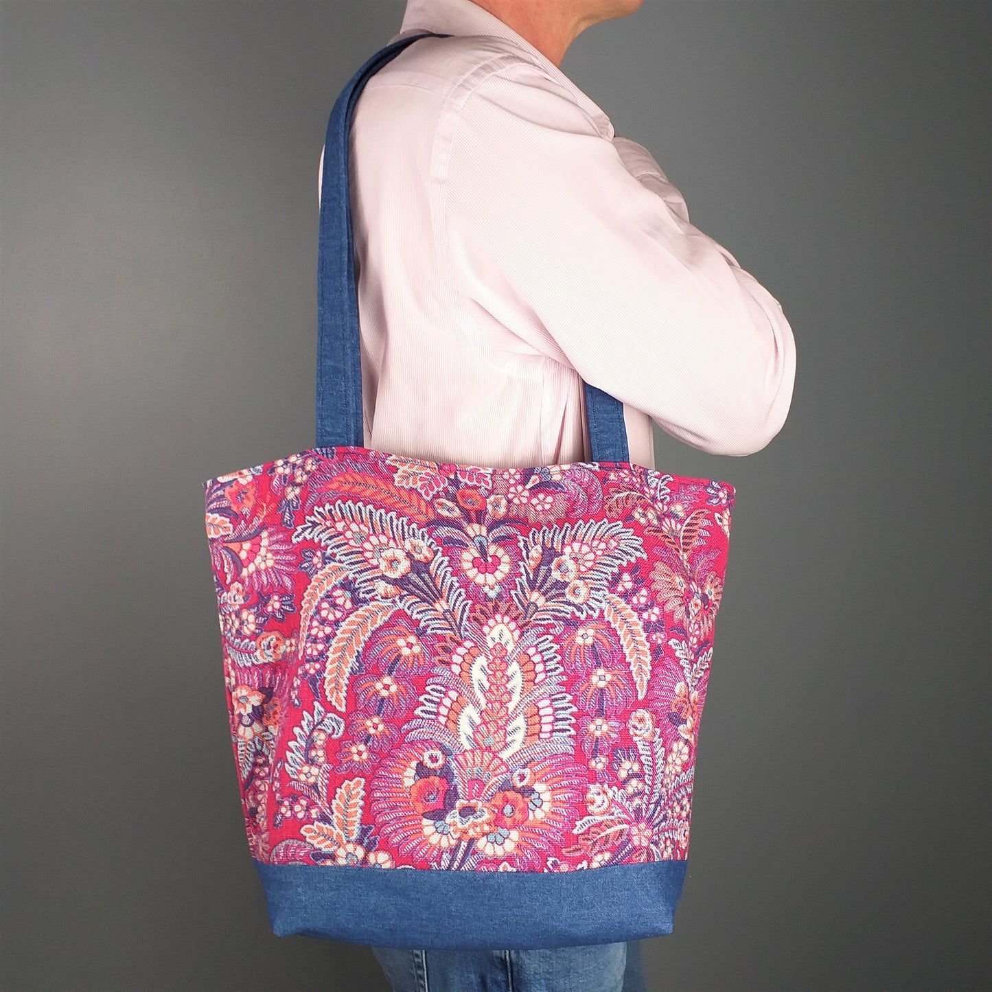 Large tote bag with multi-colour floral pattern, solid blue denim colour base