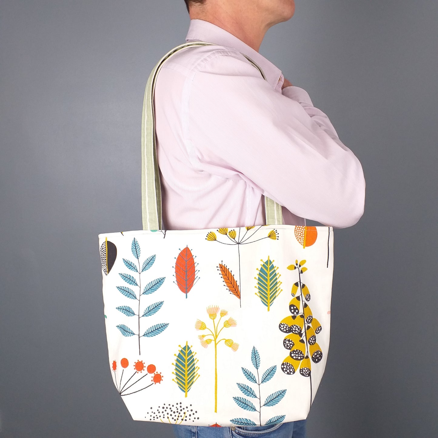 Large tote bag with multi-colour wild flowers design on off-white background