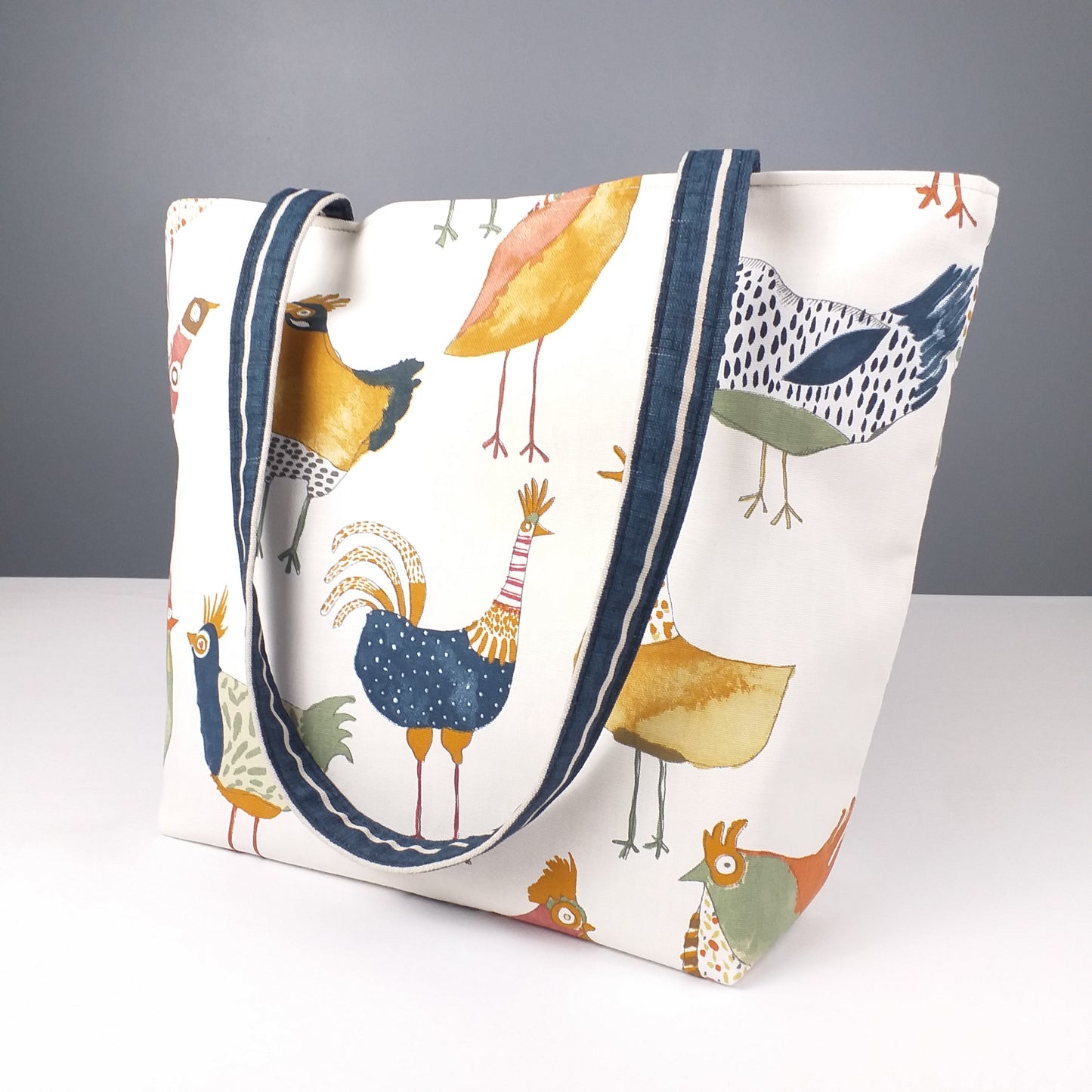 Large mini tote bag with multi-colour hens design on beige background