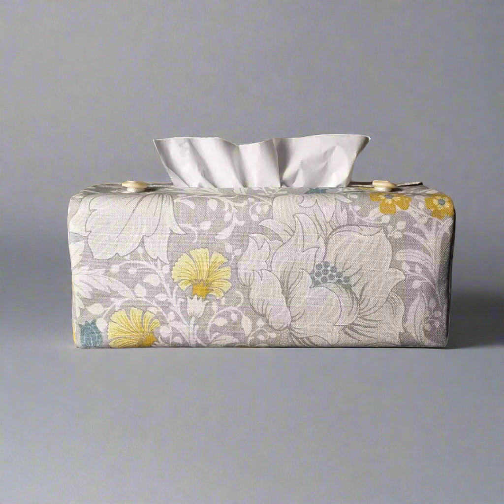 Rectangle tissue box cover with white magnolia flowers design with blue, yellow, and grey accents