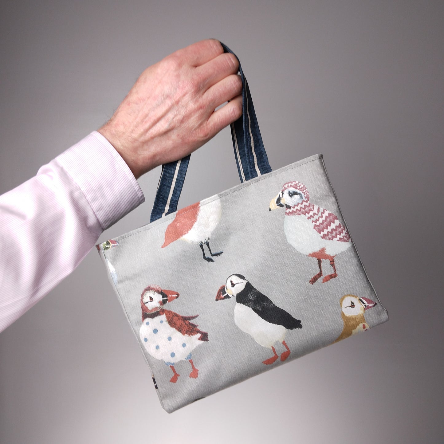 Mini tote bag with multi-colour puffins design on grey background