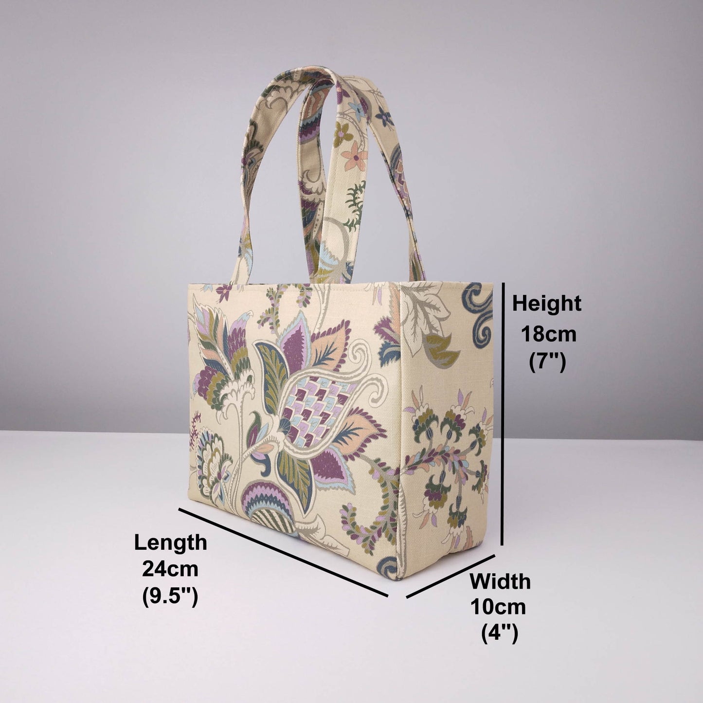 Mini tote bag with multi-colour floral print on beige background