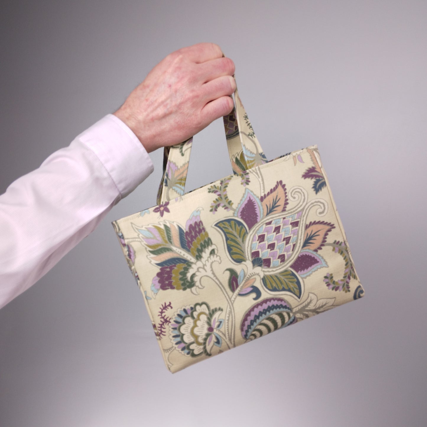 Mini tote bag with multi-colour floral print on beige background