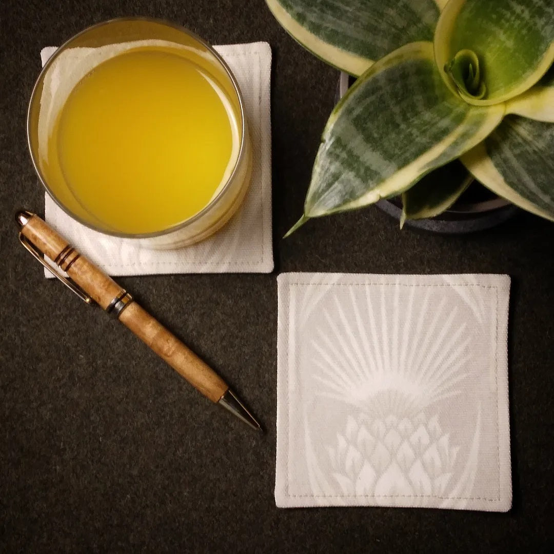 Square coasters with off-white thistle pattern on ivory colour background