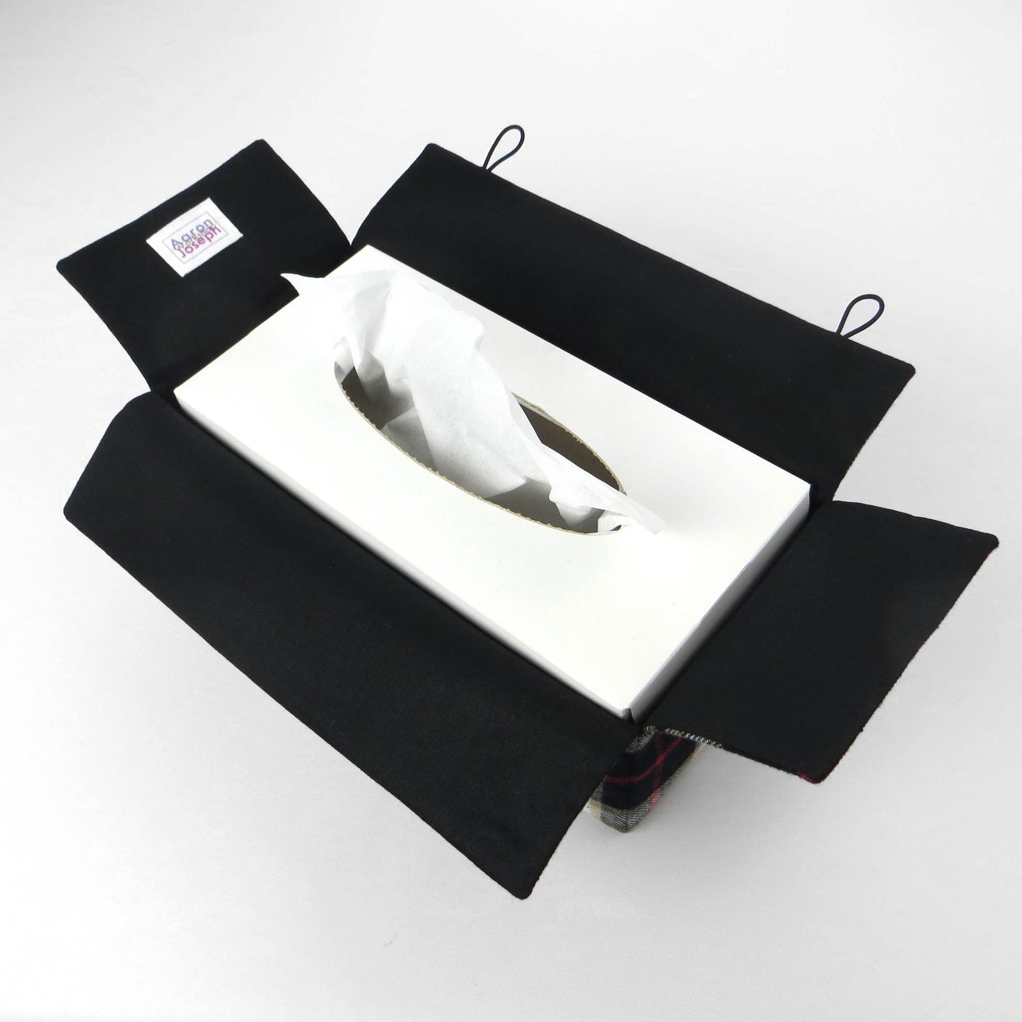 Woven brushed cotton rectangle tissue box cover with black and tan tartan pattern with a red stripe