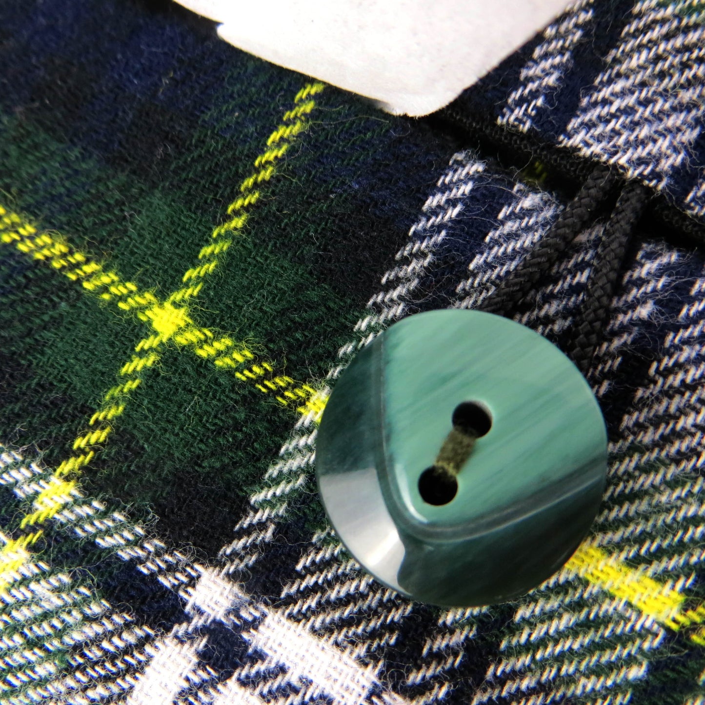 Woven brushed cotton rectangle tissue box cover with blue, green, and white tartan pattern with a yellow stripe