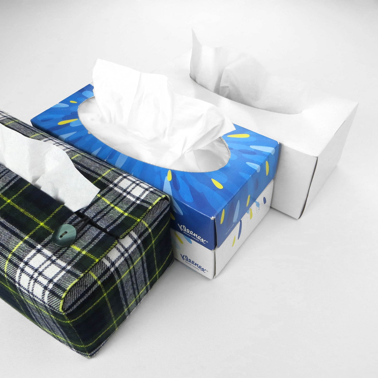 Woven brushed cotton rectangle tissue box cover with blue, green, and white tartan pattern with a yellow stripe