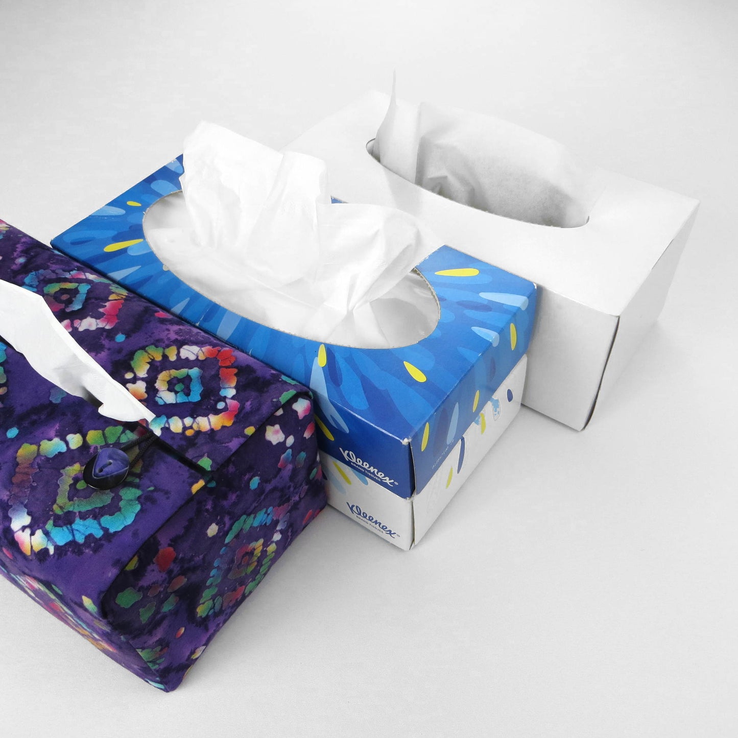 Batik printed cotton rectangle tissue box cover with tie dye multi colour diamond design on purple background