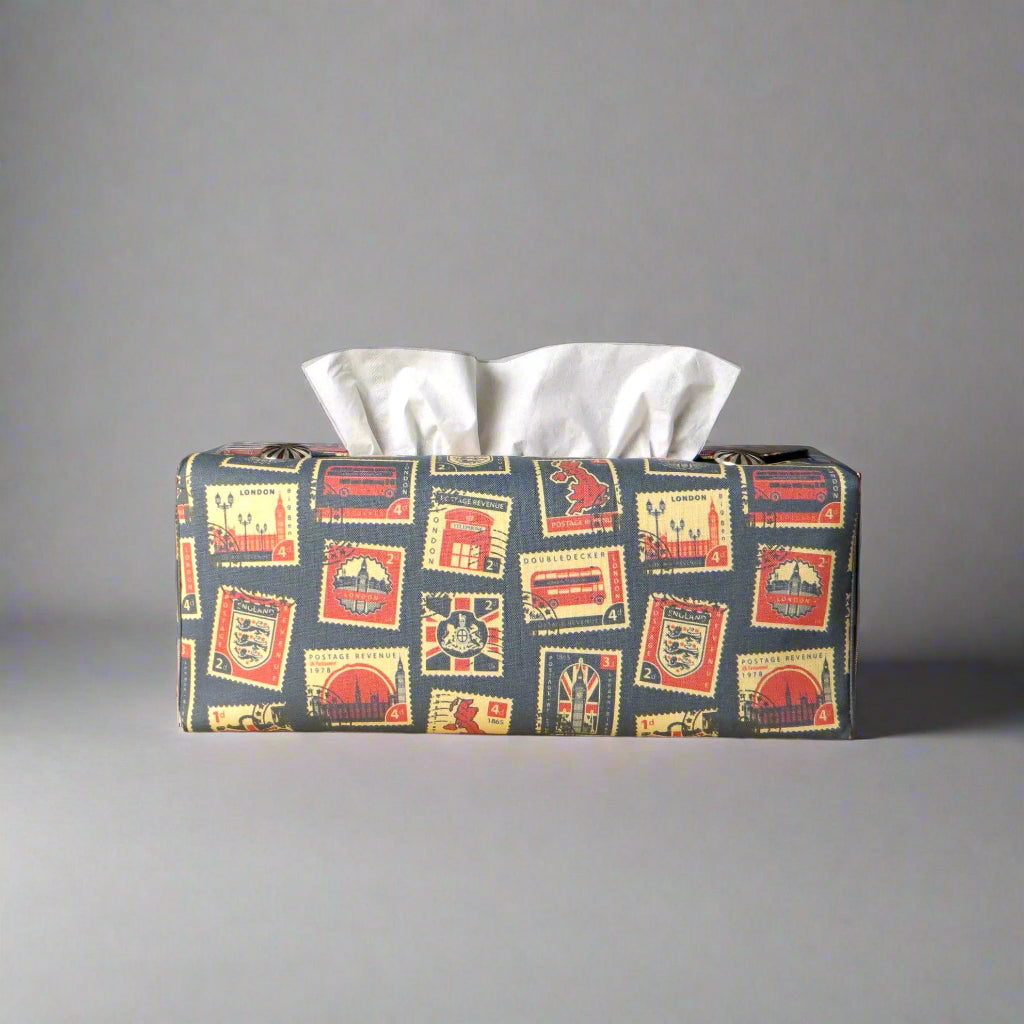Printed cotton rectangle tissue box cover with British stamps design on pale navy background