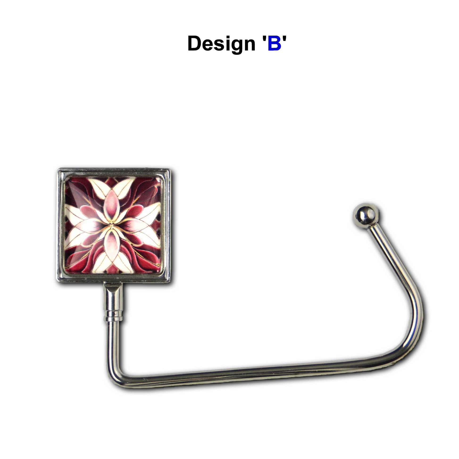 Handbag hook with glass domed image for hanging accessories on tables, ledges, and shelves
