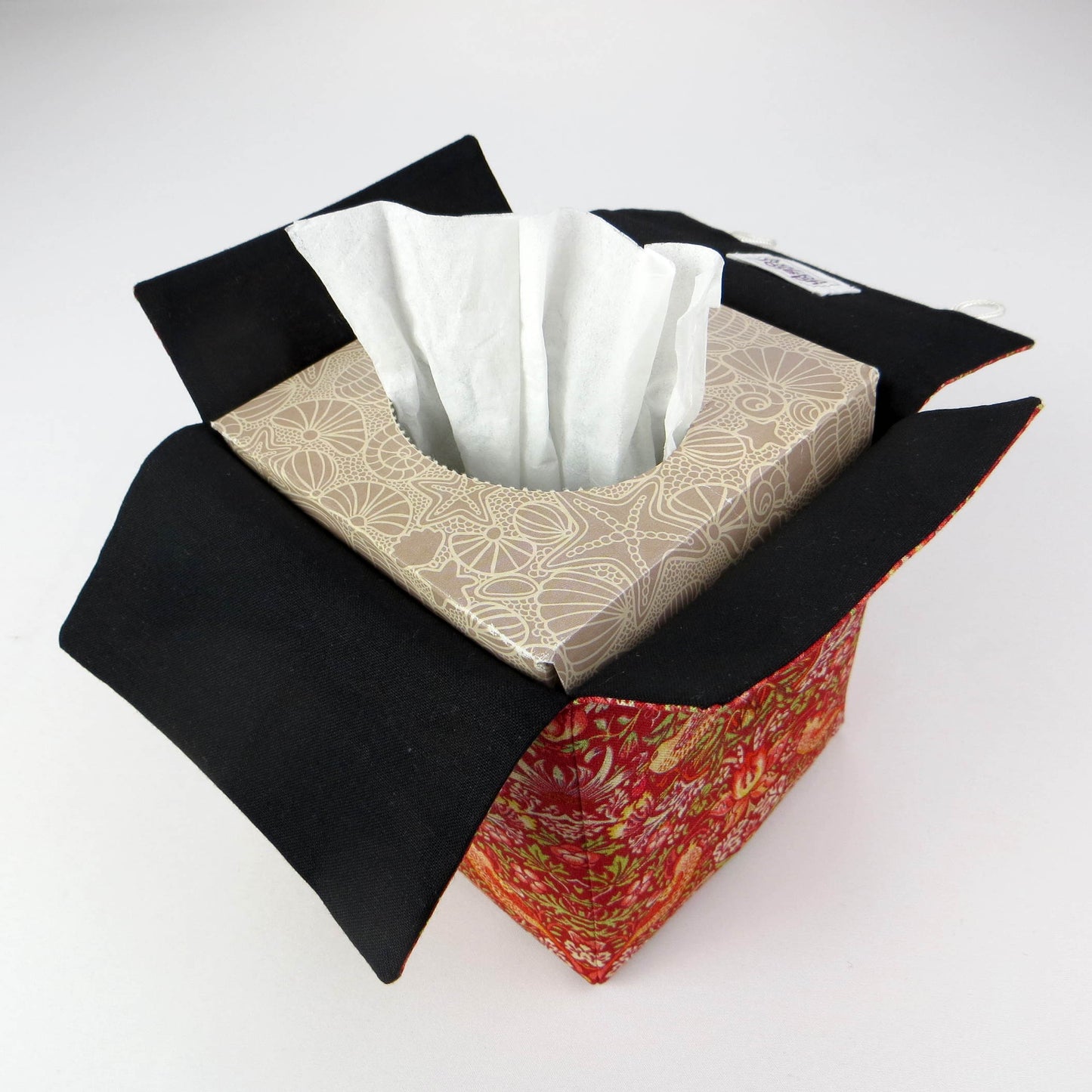 Square tissue box cover with birds and berries design on red background