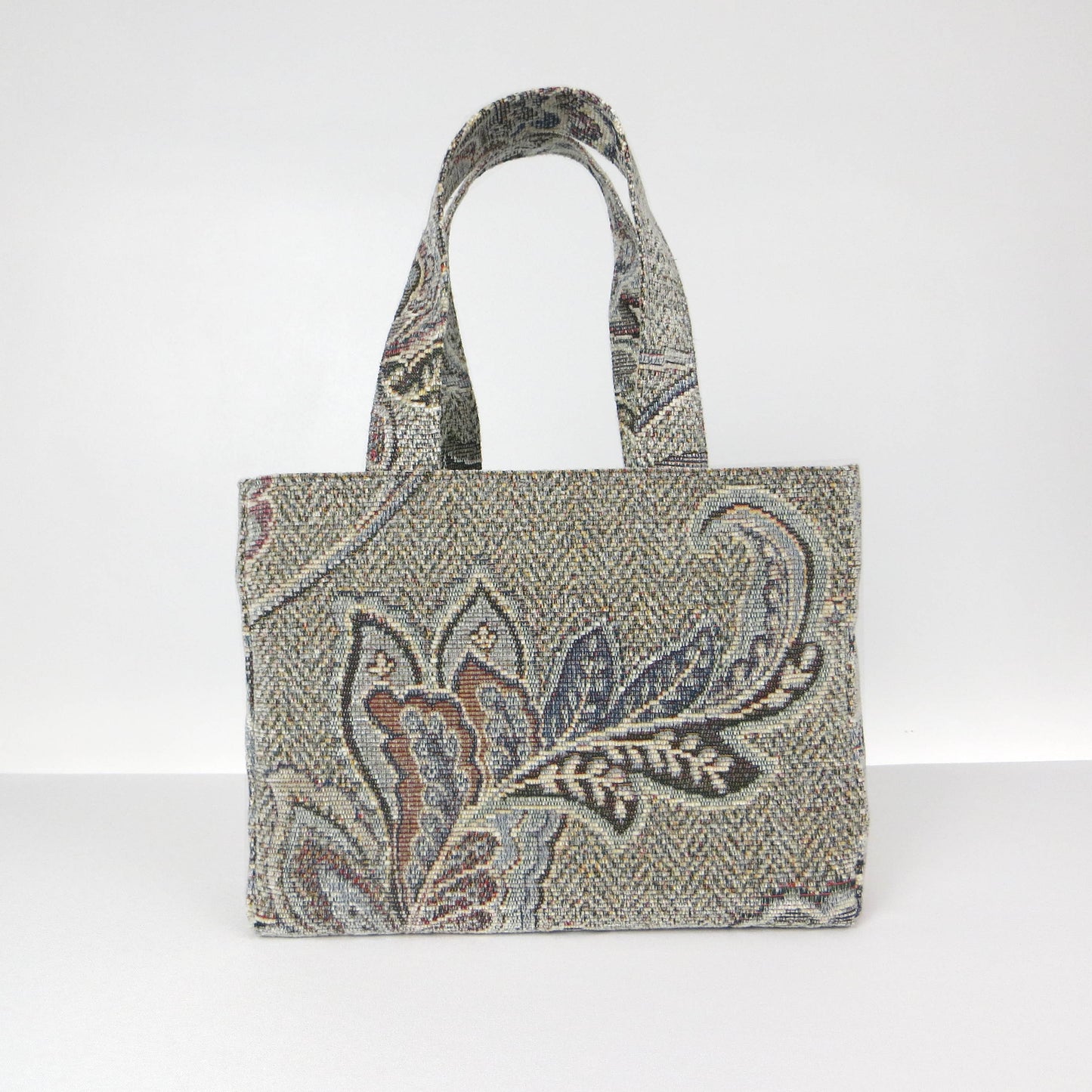 Mini tote bag with blue and grey floral design, and blue lining