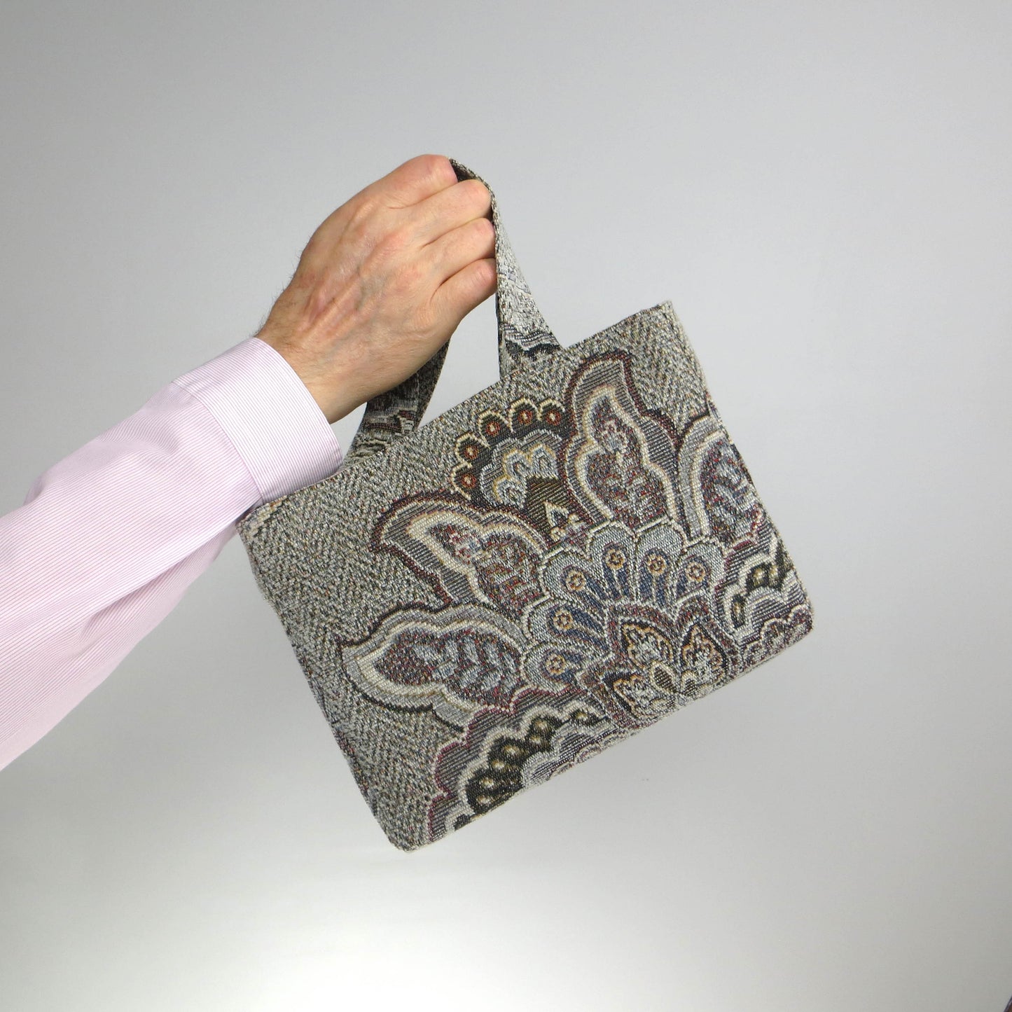 Mini tote bag with blue and grey floral design, and blue lining