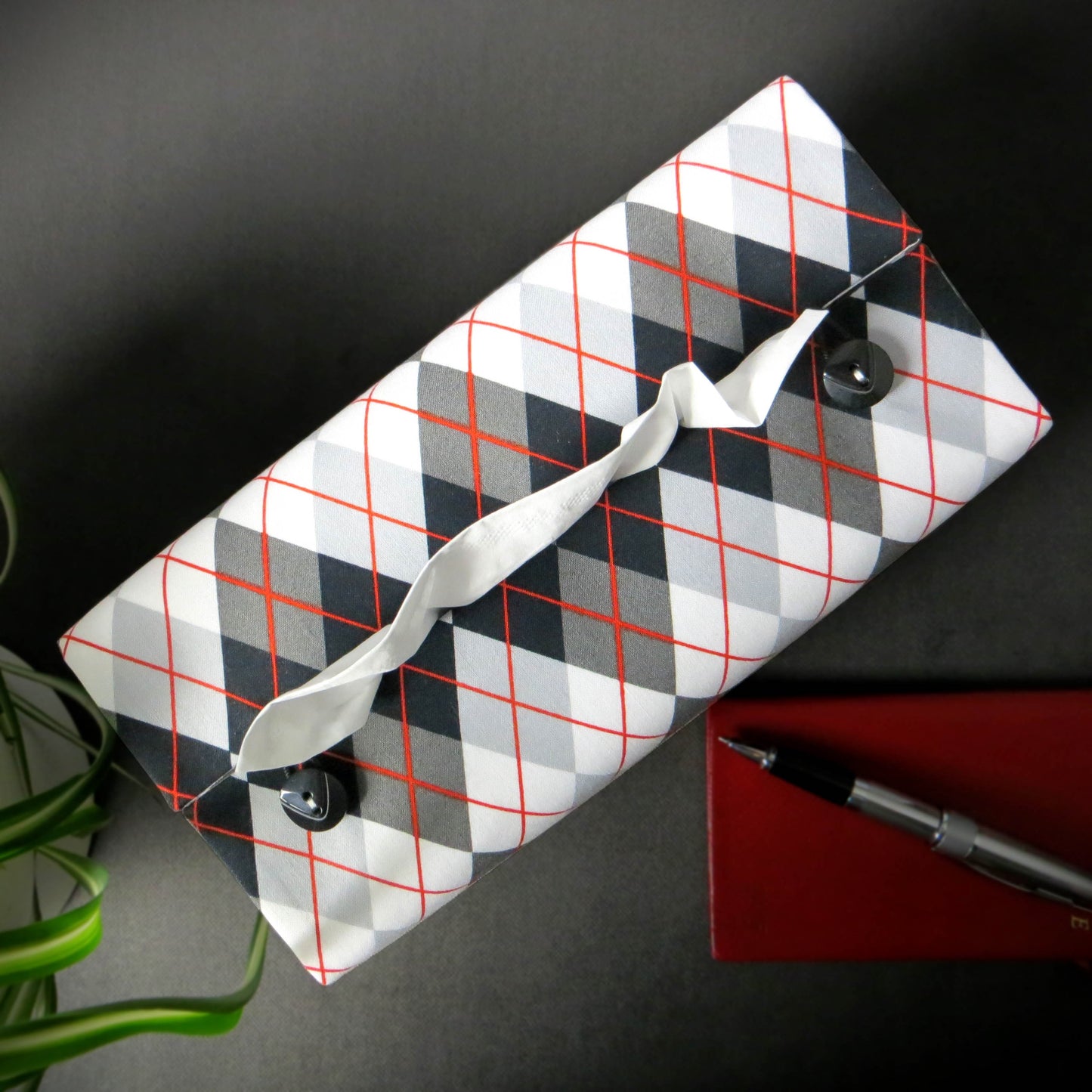 Rectangular tissue box cover with black, grey, and red argyle pattern
