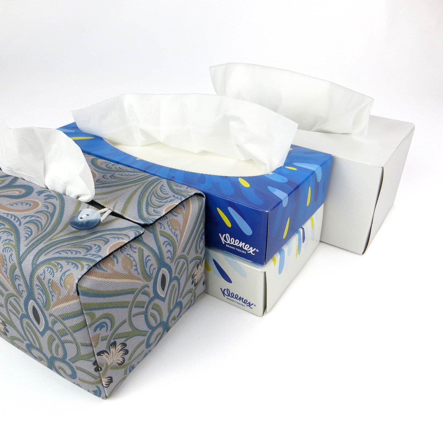 Rectangular tissue box cover with charcoal grey and white flowers with blue, green and taupe Victorian embellishment on blue-grey background