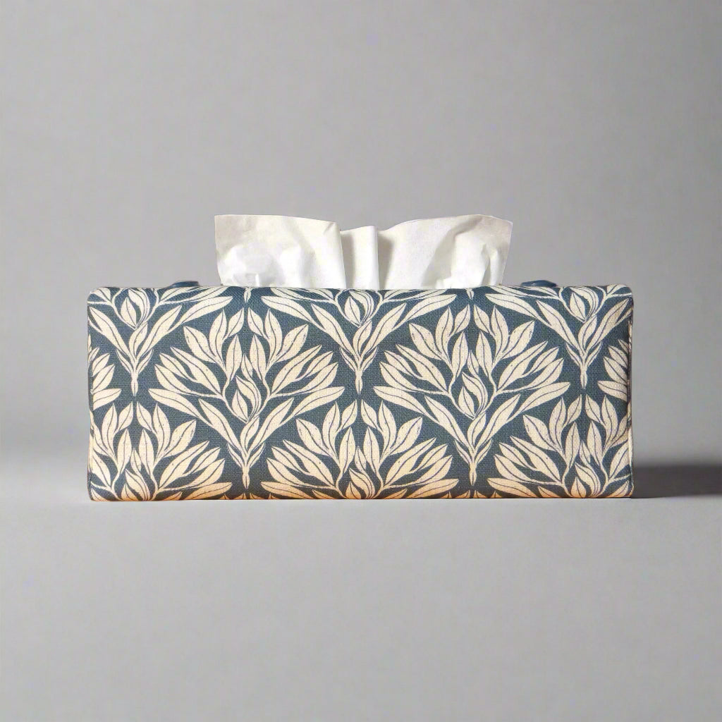 Linen rectangular tissue box cover with an off-white leaf pattern on a blue background