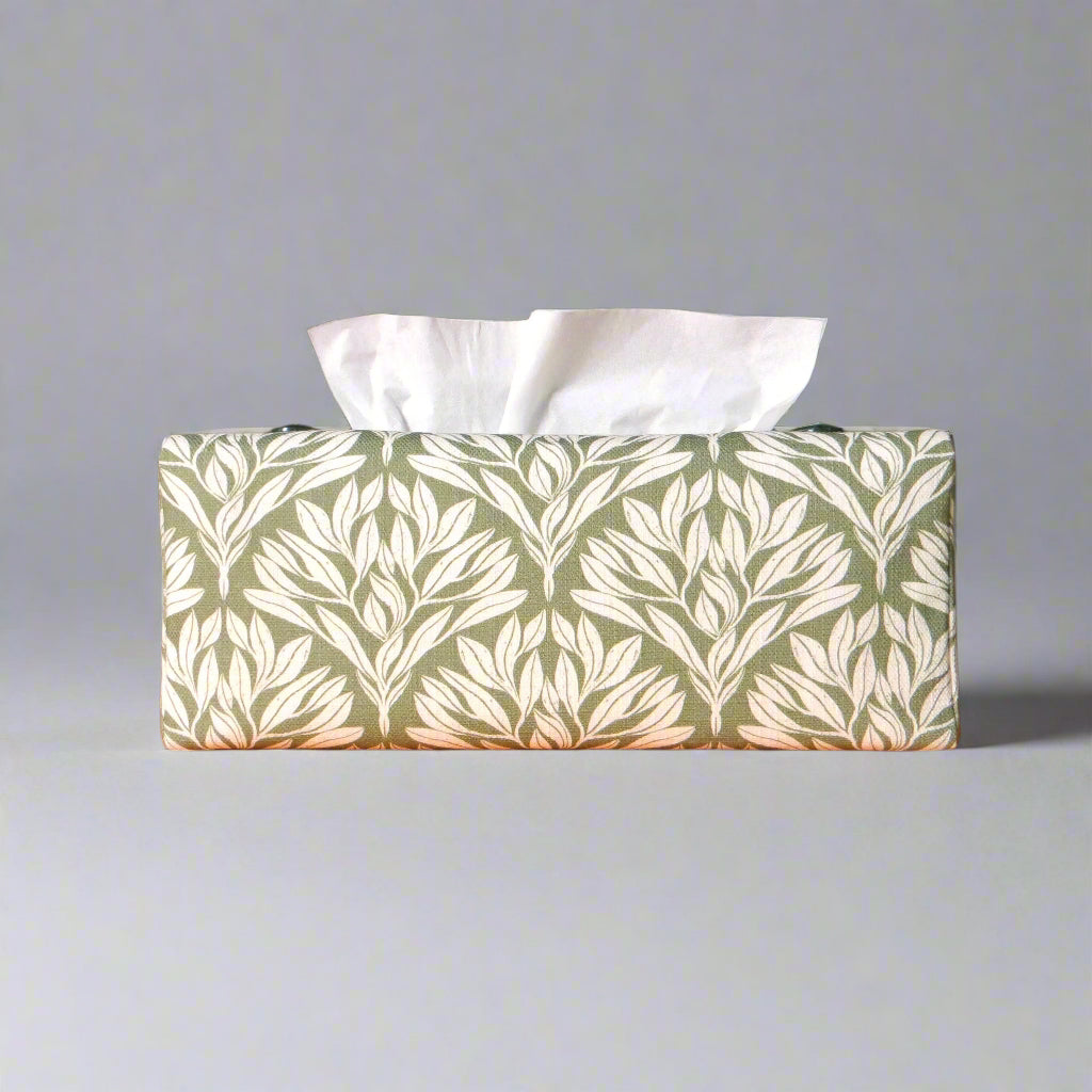 Linen rectangular tissue box cover with an off-white leaf pattern on a sage green background