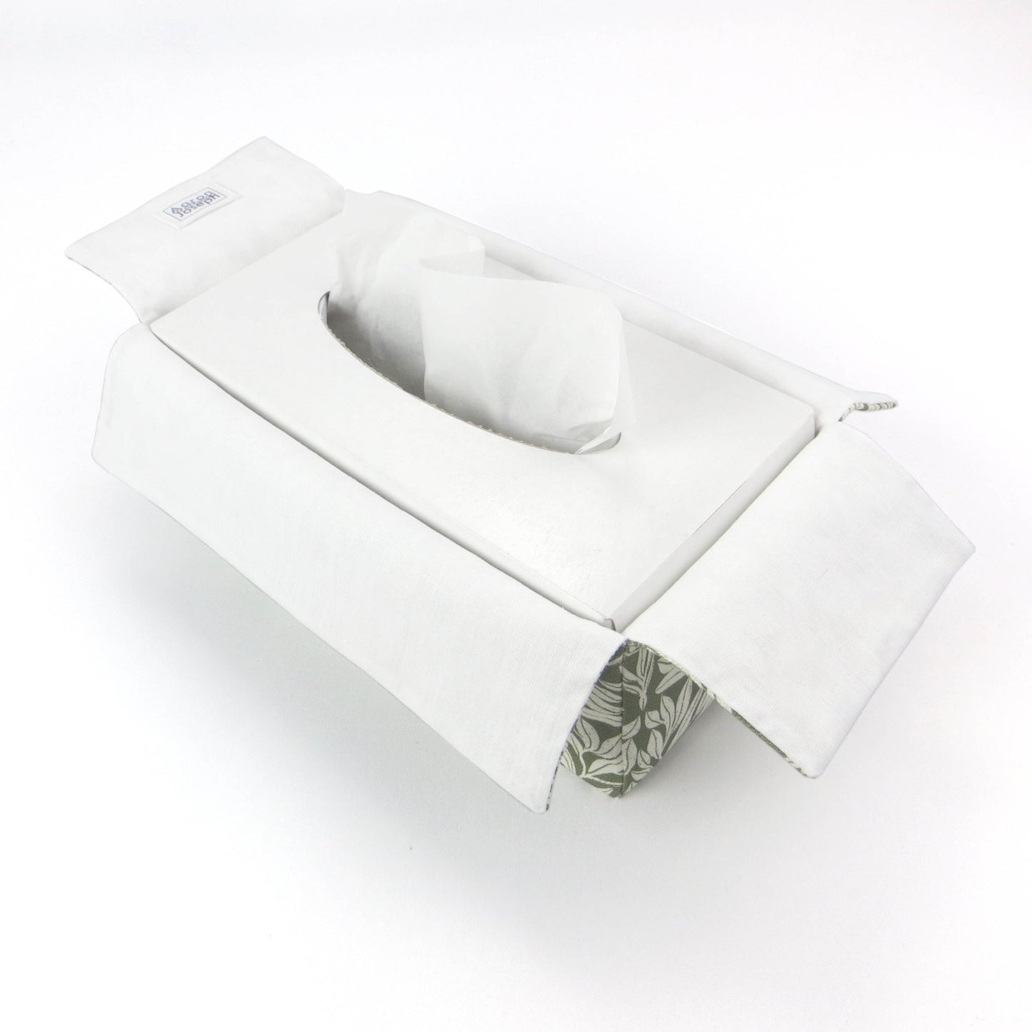 Linen rectangular tissue box cover with an off-white leaf pattern on a sage green background