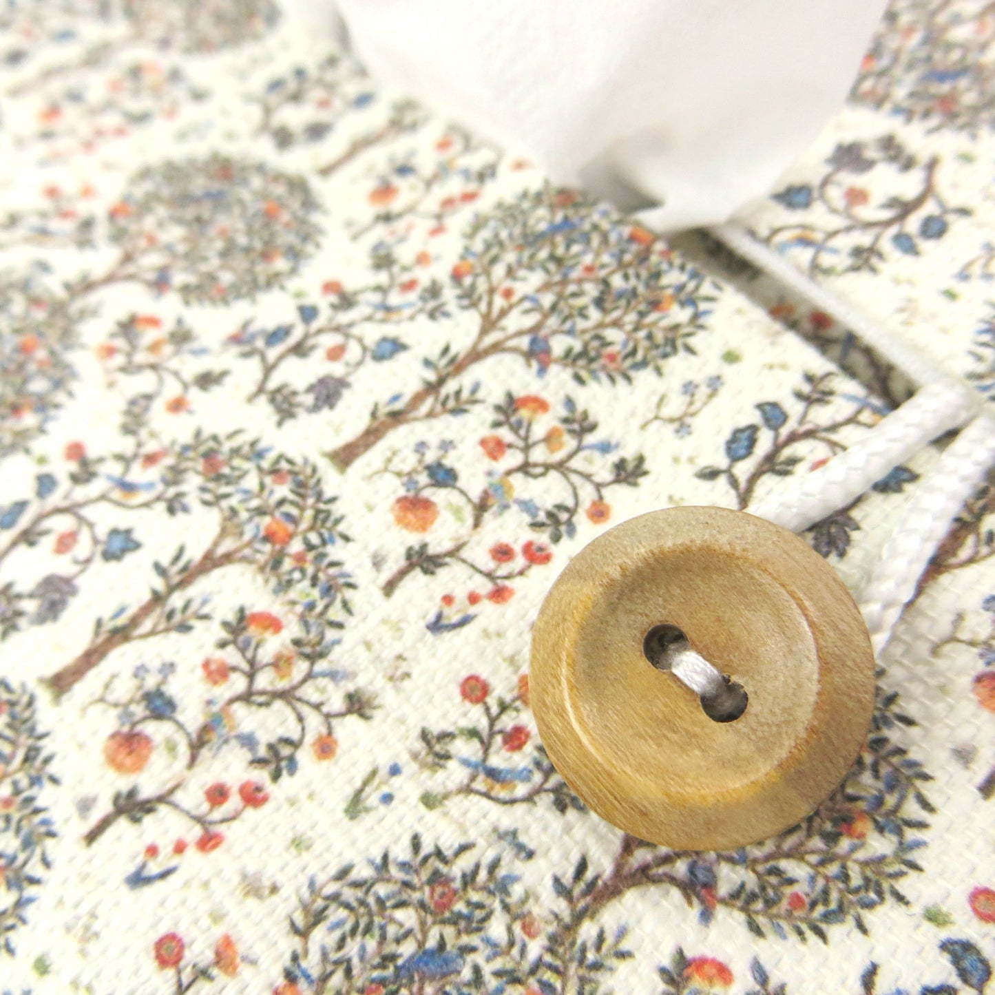 Linen rectangle tissue box cover with  a mini orchard grove pattern