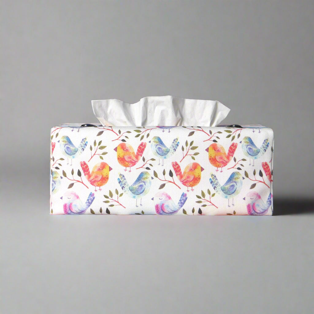 Cotton rectangle tissue box cover with watercolour style blue, purple, and orange sleeping birds on white background