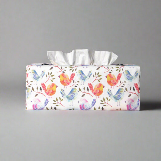 Cotton rectangle tissue box cover with watercolour style blue, purple, and orange sleeping birds on white background