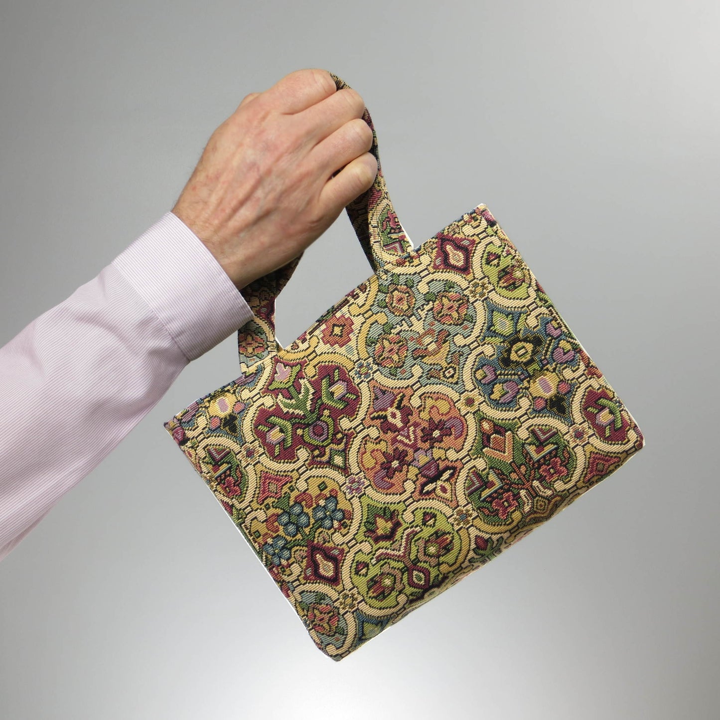 Mini tote bag with multi colour geometric pattern and purple velvet lining