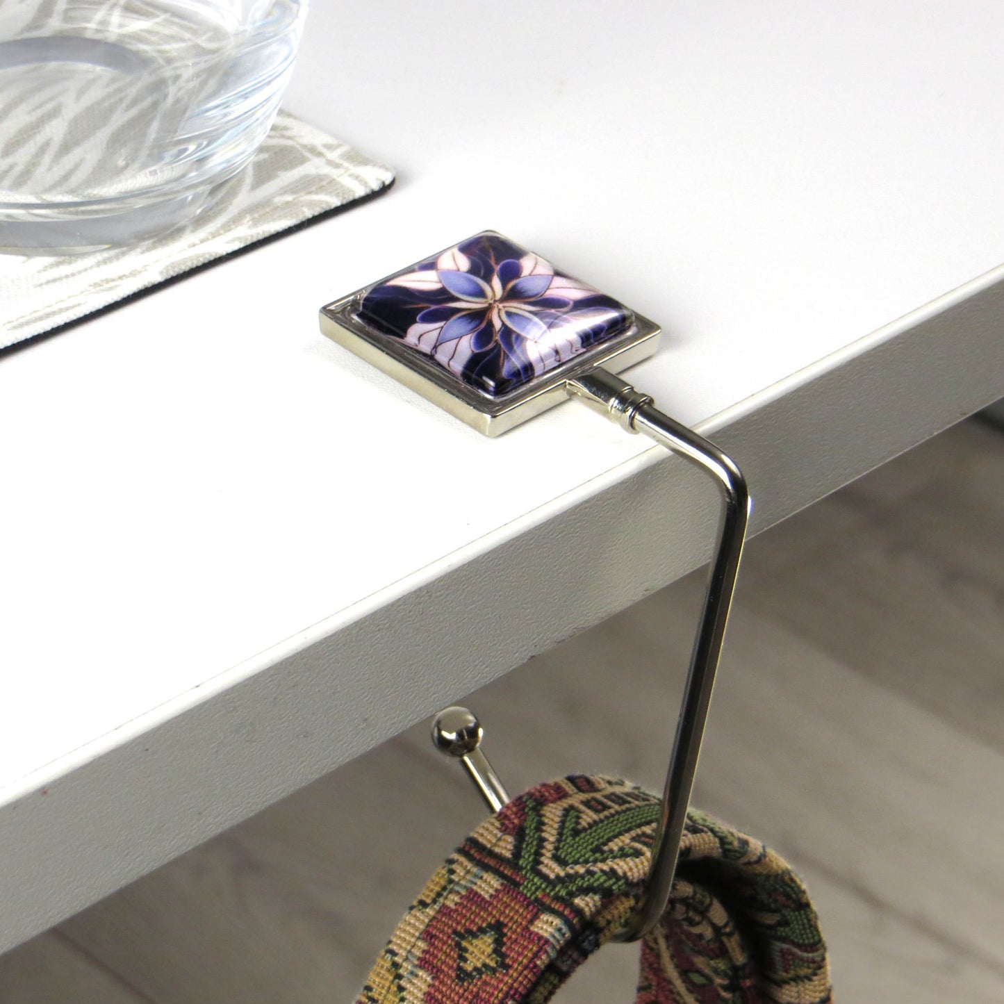 Handbag hook with glass domed image for hanging accessories on tables, ledges, and shelves