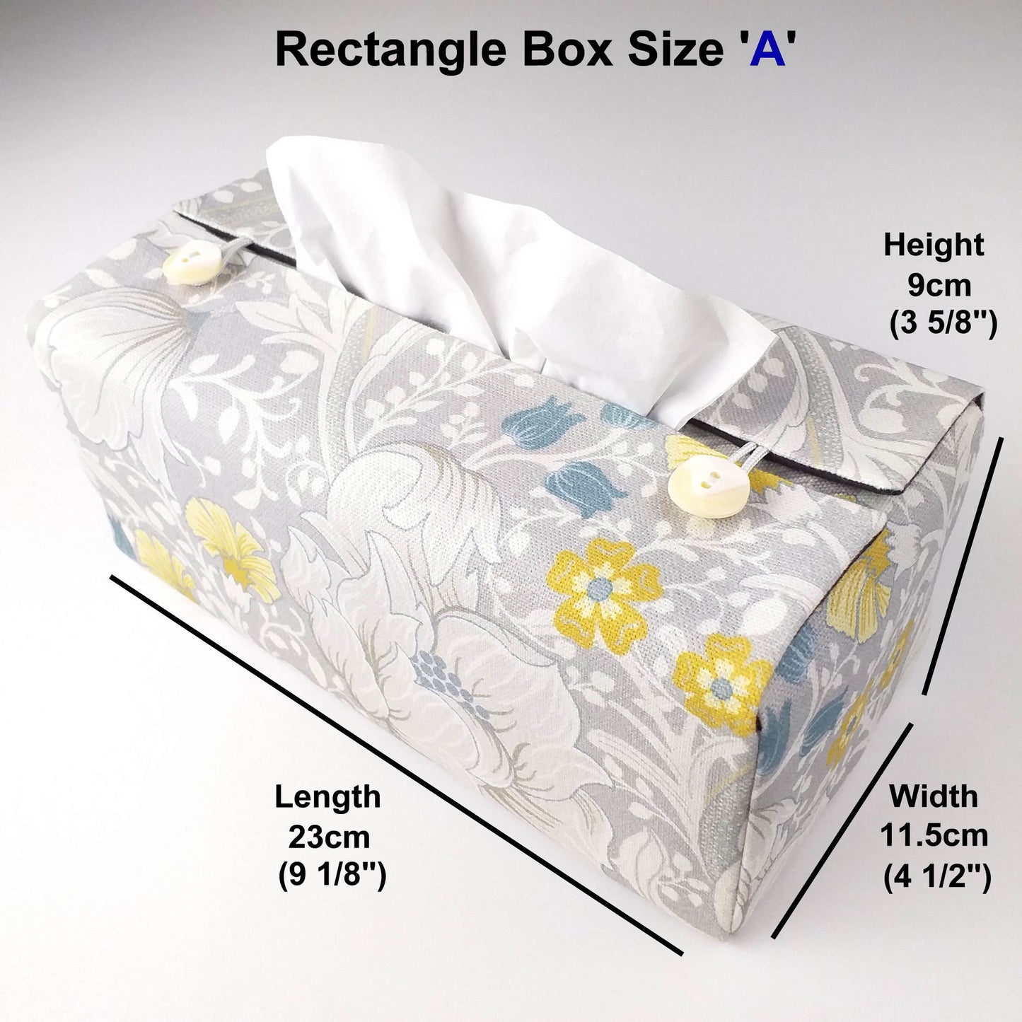 Rectangle tissue box cover with white magnolia flowers design with blue, yellow, and grey accents