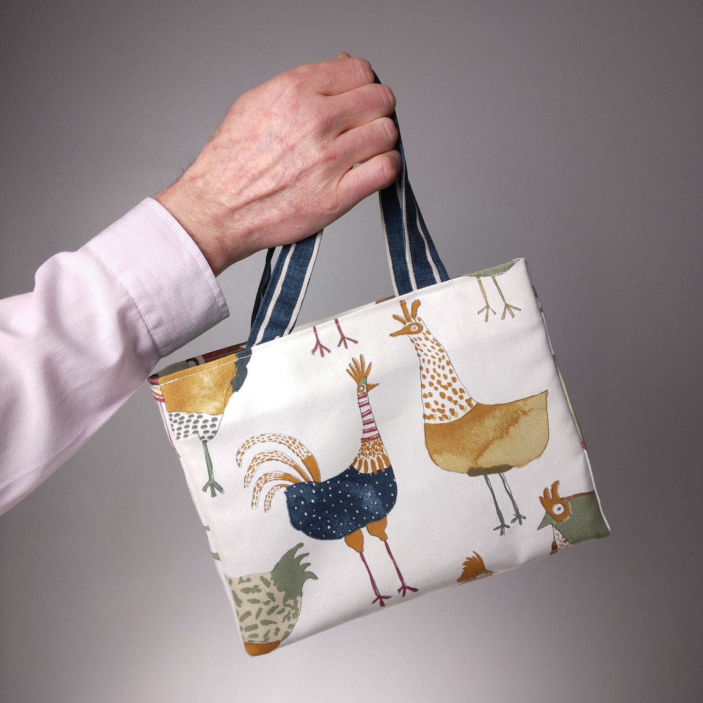 Mini tote bag with multi-colour hens design on beige background