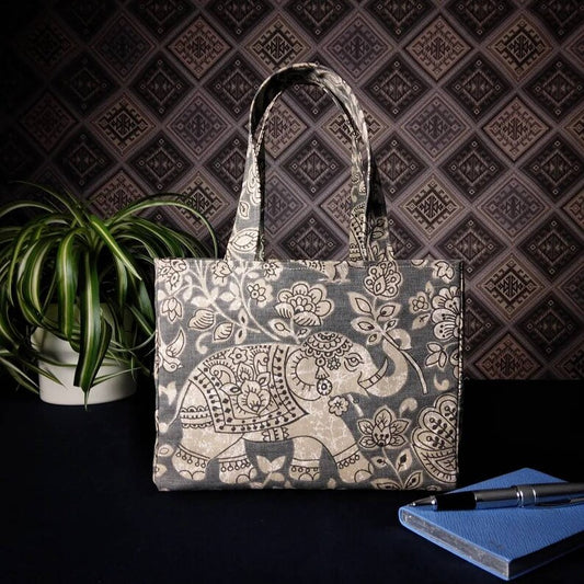 Mini tote bag with ornate taupe elephant design on grey background