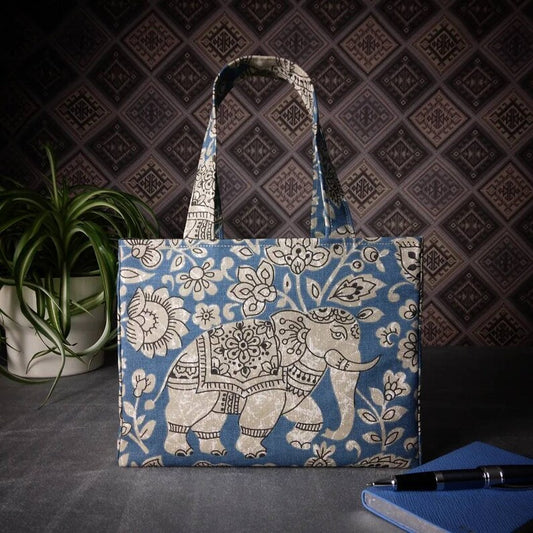 Mini tote bag with ornate taupe elephant design on blue background