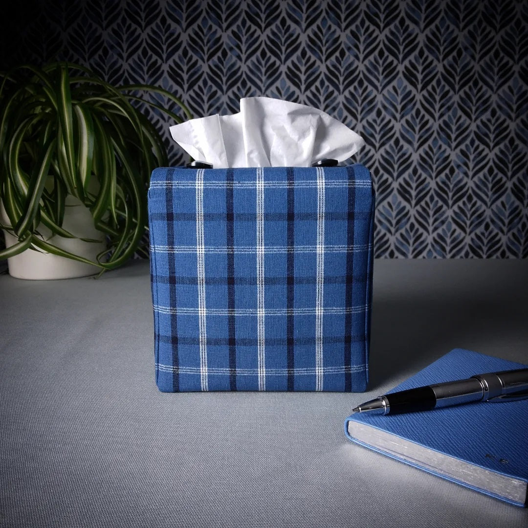 Square tissue box cover with black, white, and blue plaid pattern