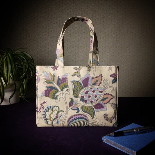 Mini tote bag with multi-colour floral print on beige background