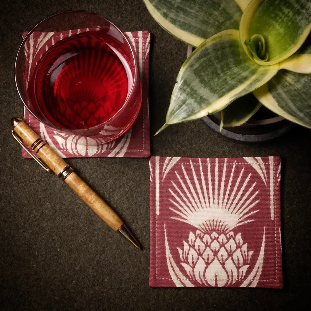 Square coasters with ivory thistle pattern on garnet colour background