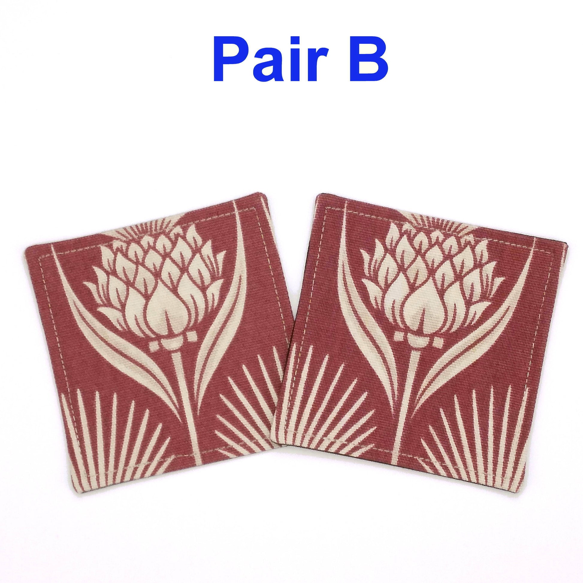 Square coasters with ivory thistle pattern on garnet colour background