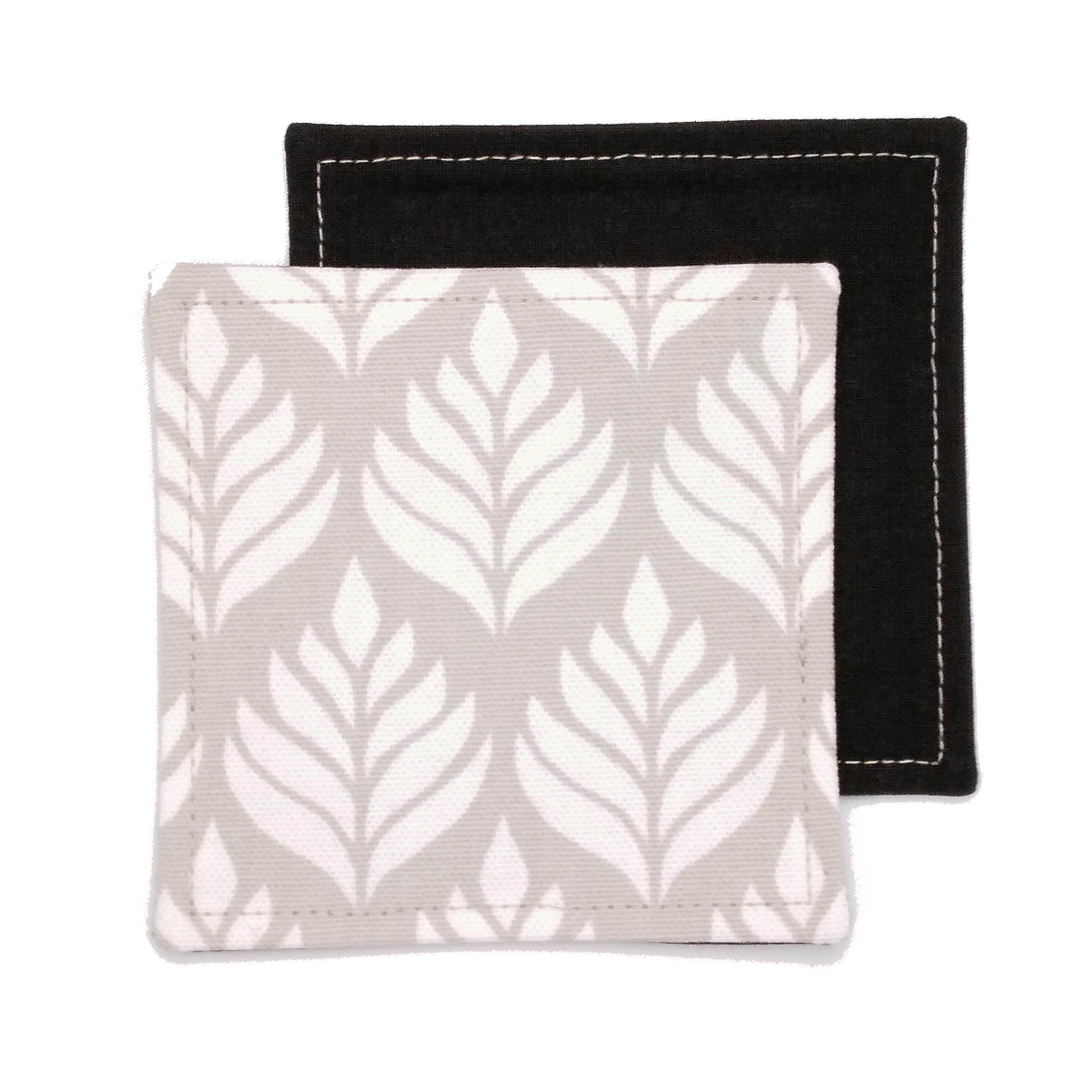 Square coasters with off-white leaf icon design on natural colour background