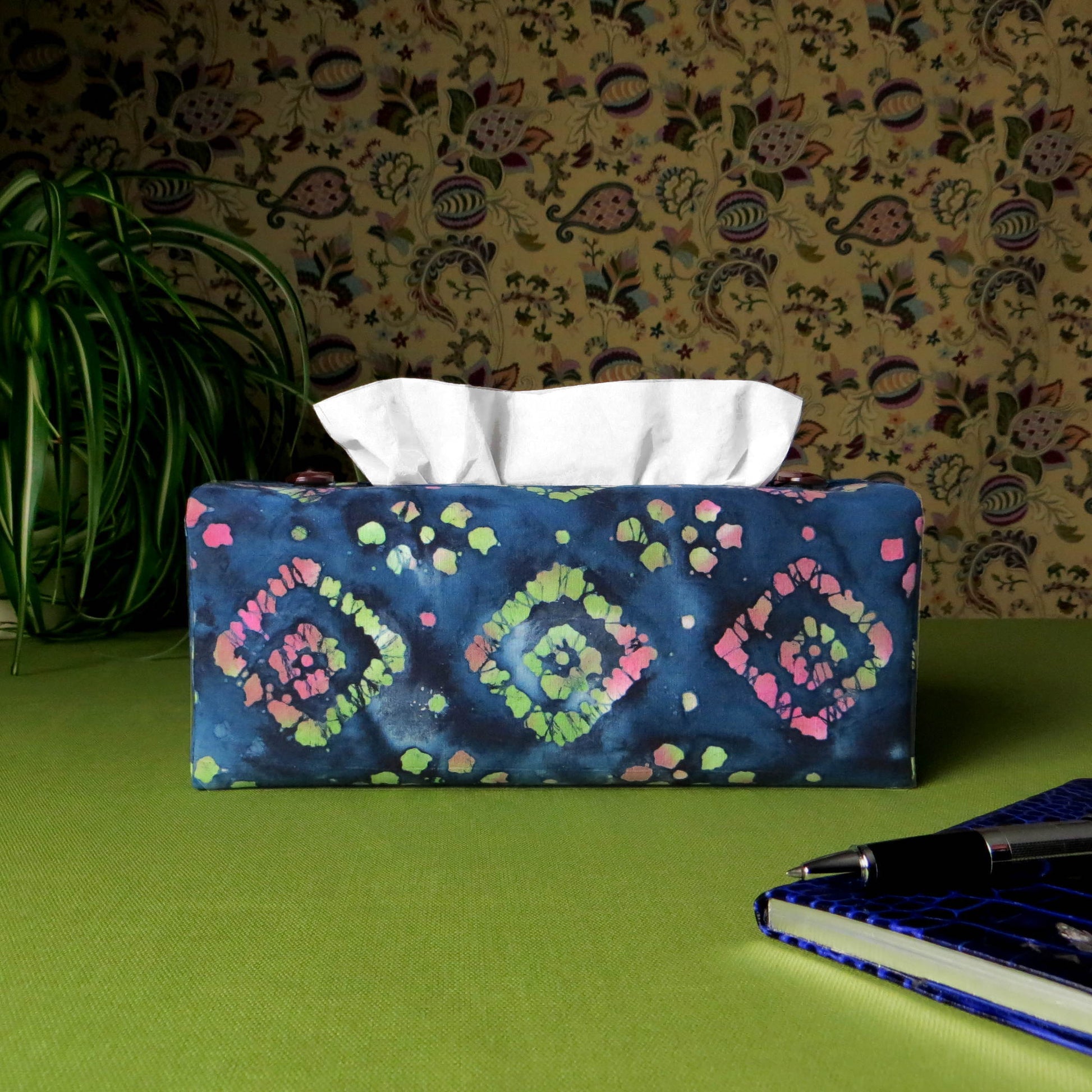Batik printed cotton rectangle tissue box cover with tie dye magenta and green diamond design on blue background