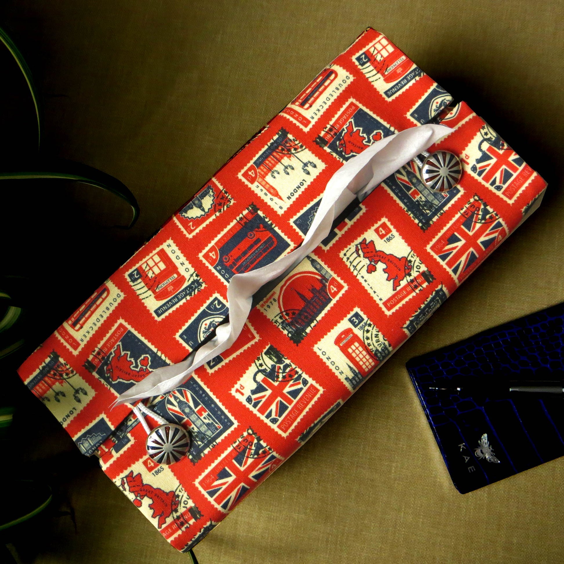 Printed cotton rectangle tissue box cover with British stamps design on red background