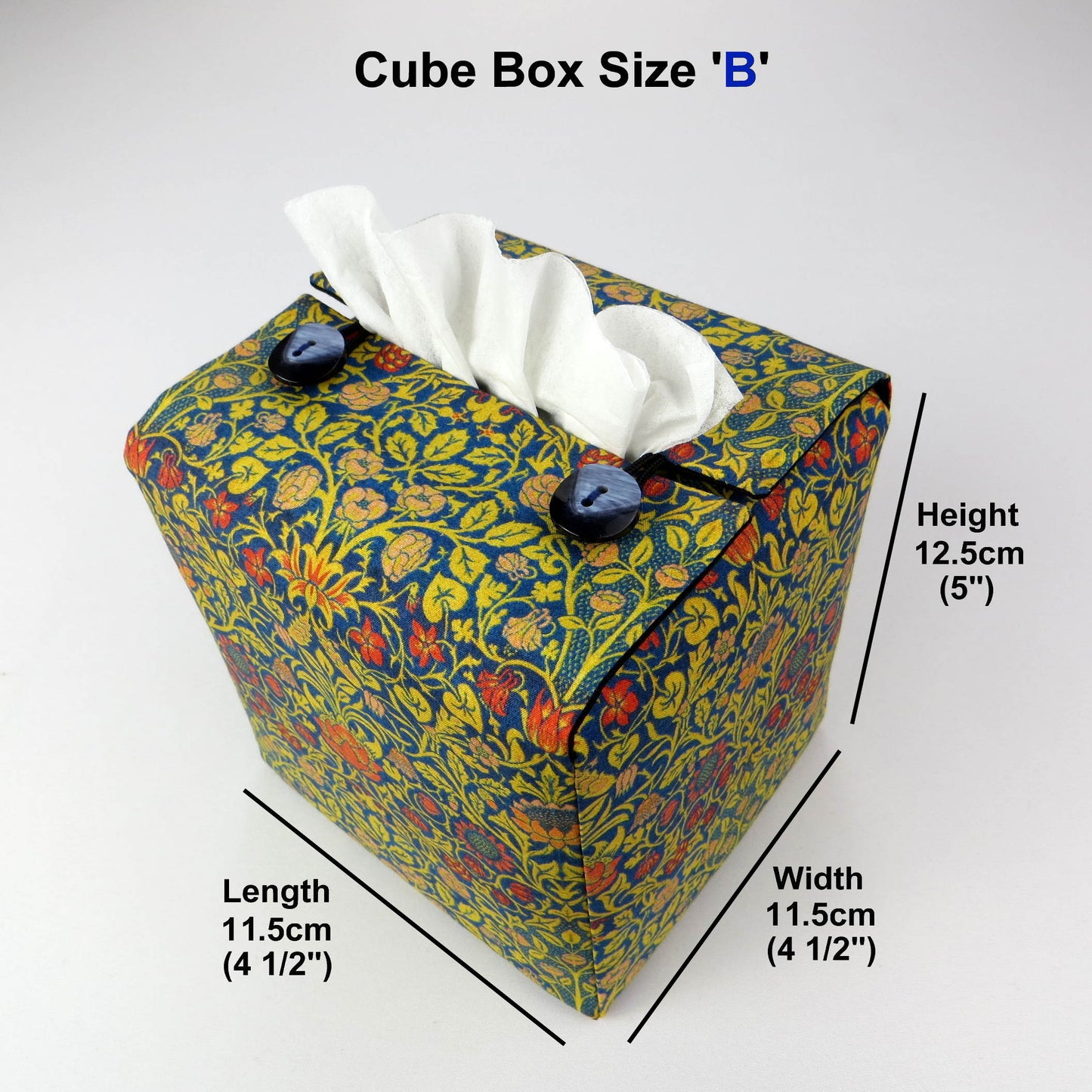 Cube tissue box cover with orange flowers and yellow vines design on blue background