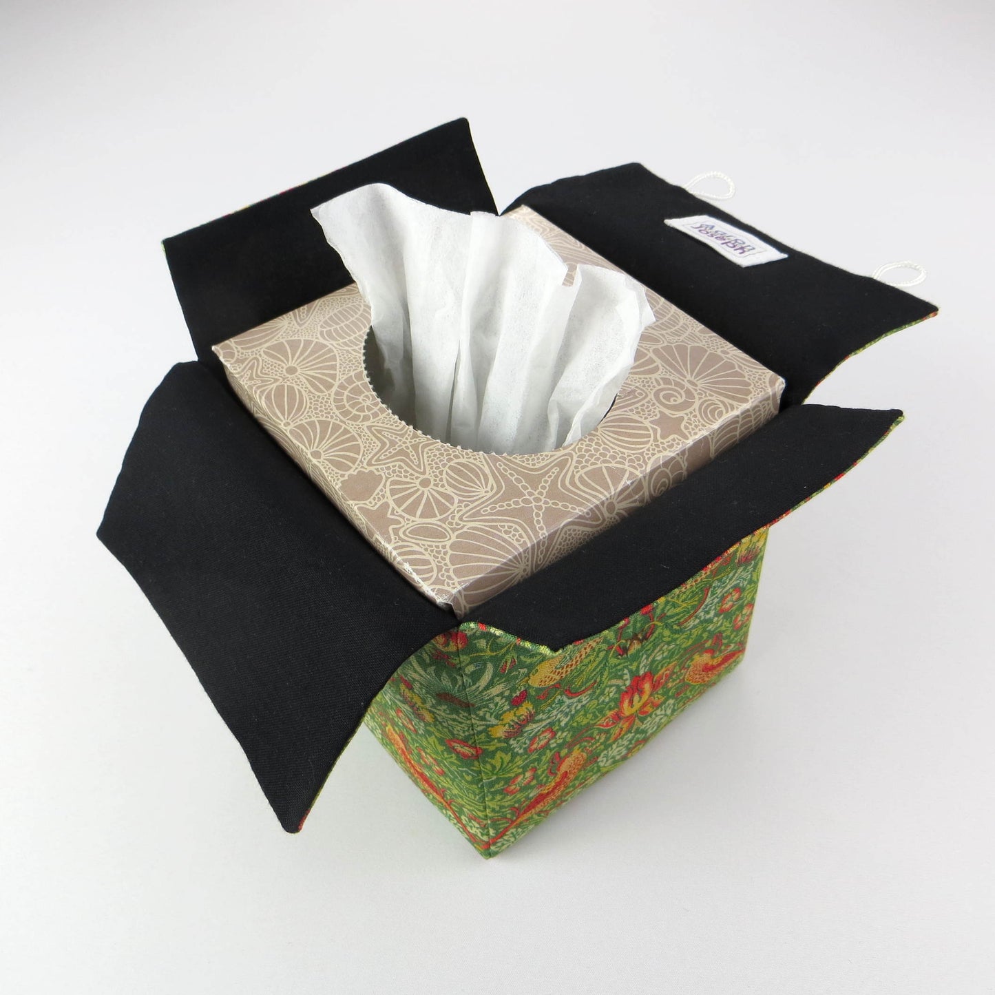 Square tissue box cover with birds and berries design on green background