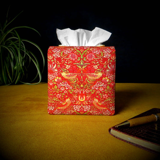 Square tissue box cover with birds and berries design on red background