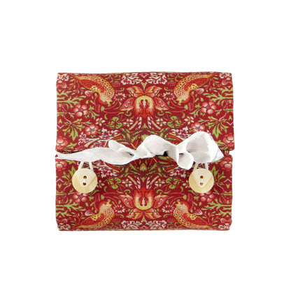 Square tissue box cover with birds and berries design on red background