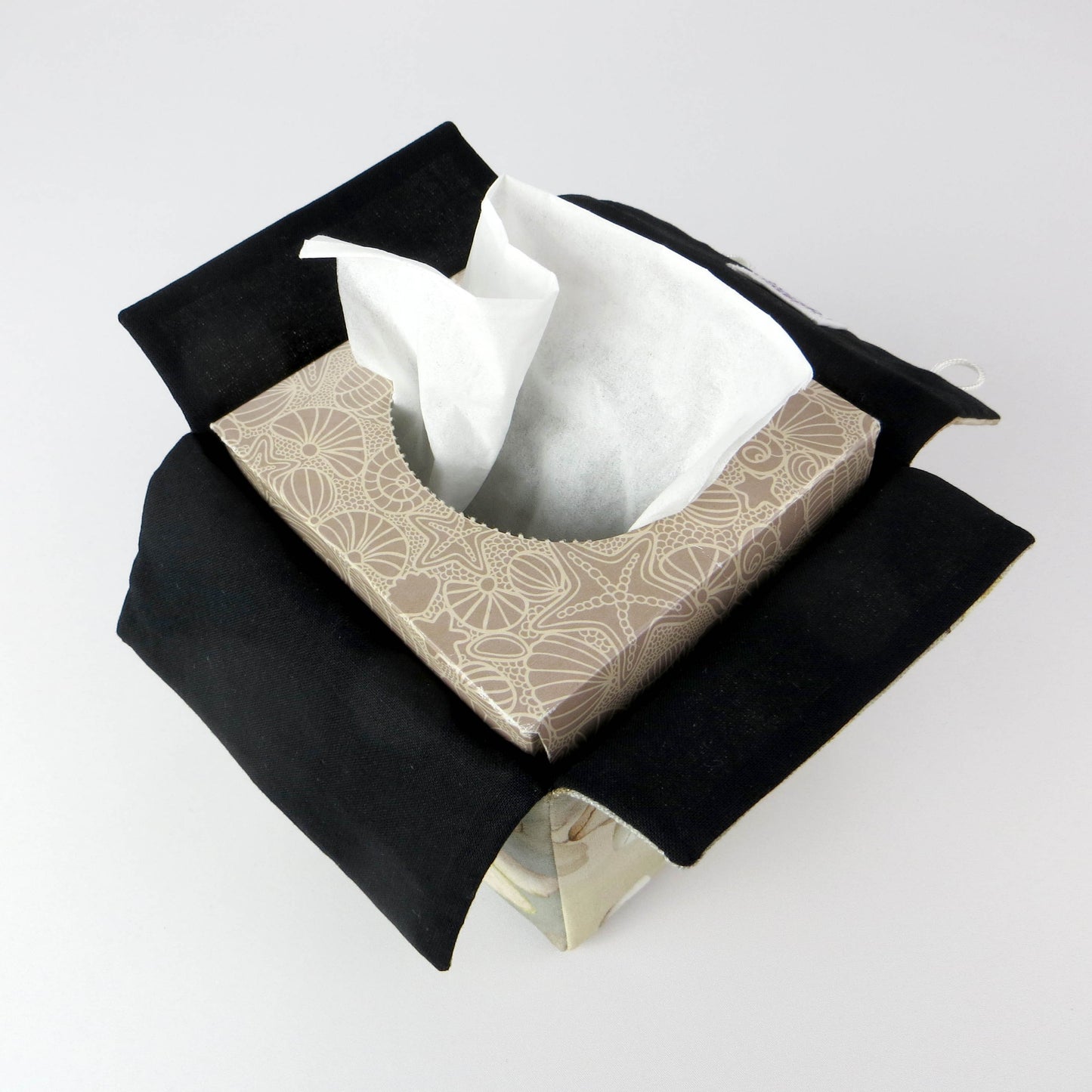 Printed cotton square tissue box with lunaria leaf design on brown background