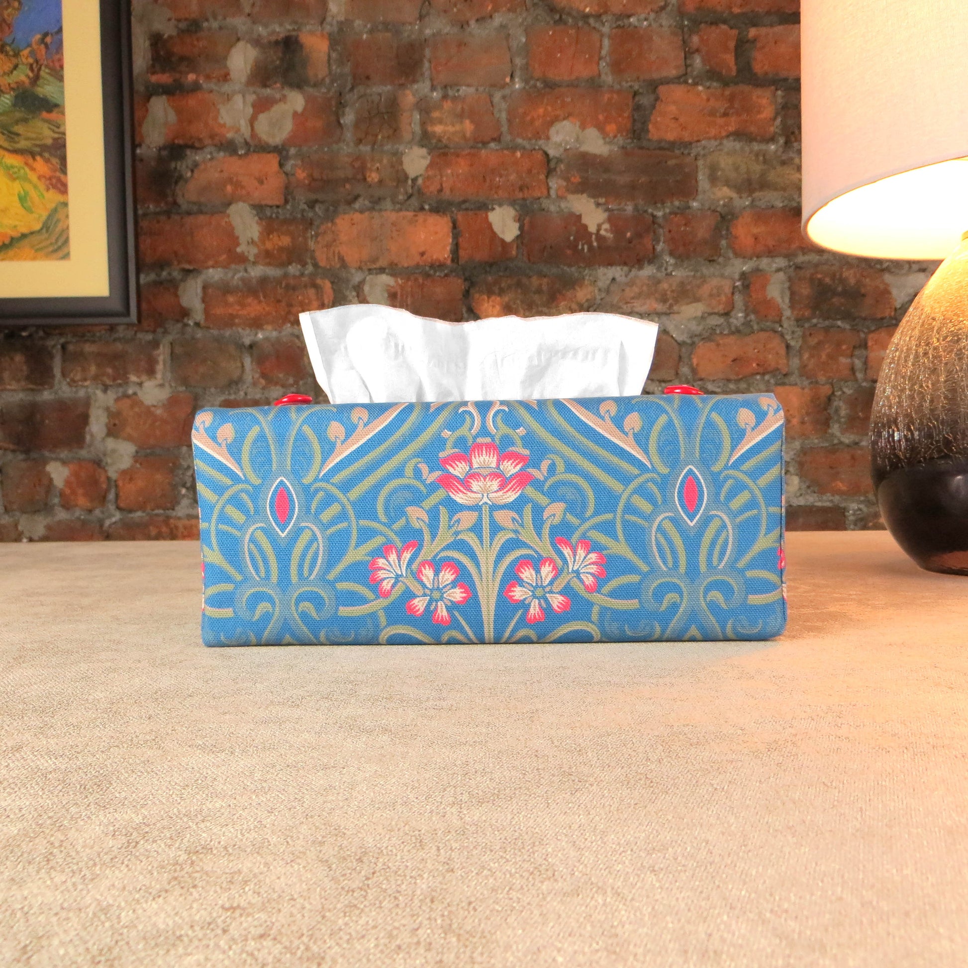 Rectangular tissue box cover with red flowers with green Victorian embellishment on blue background