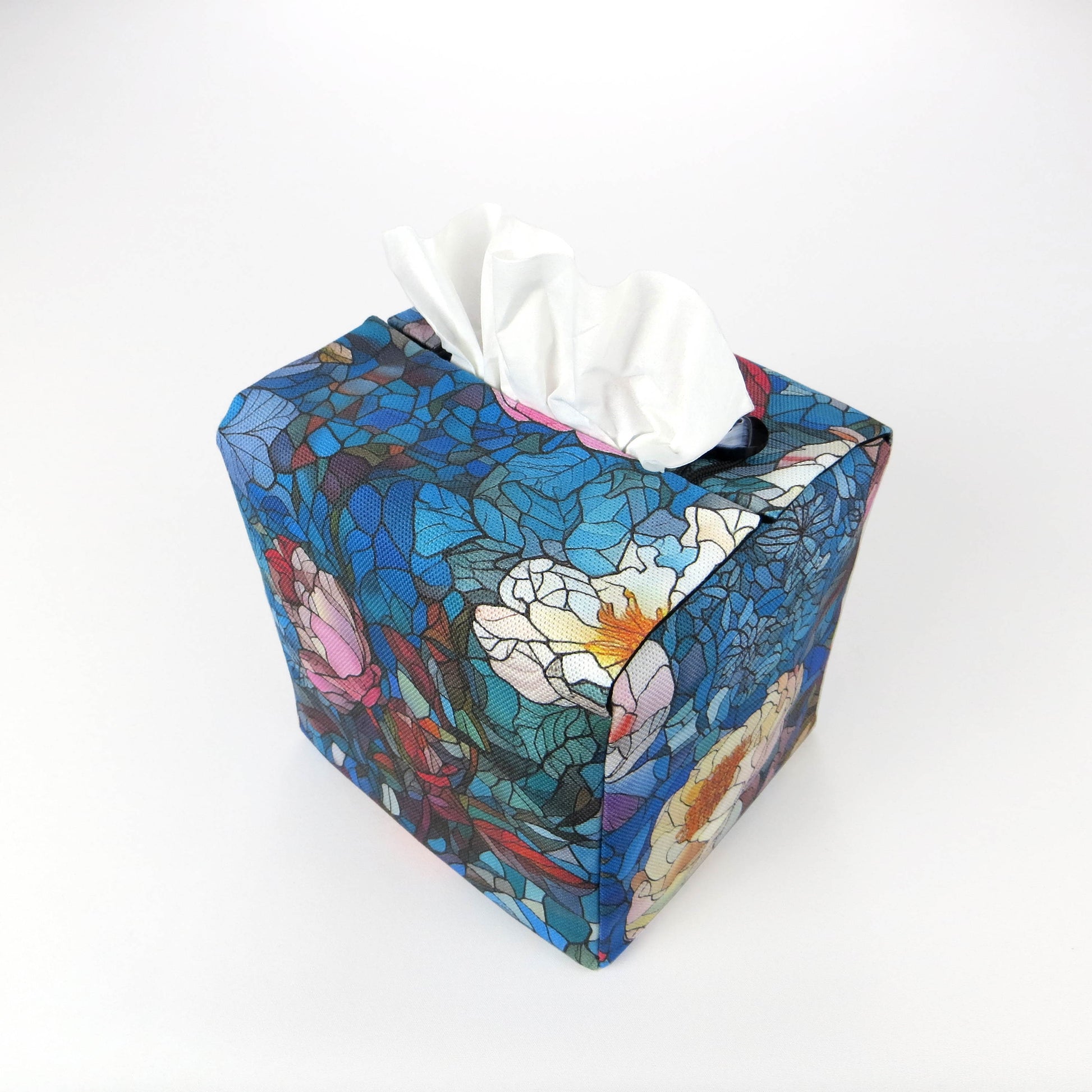 Square tissue box cover with floral garden stained glass design on blue toned background