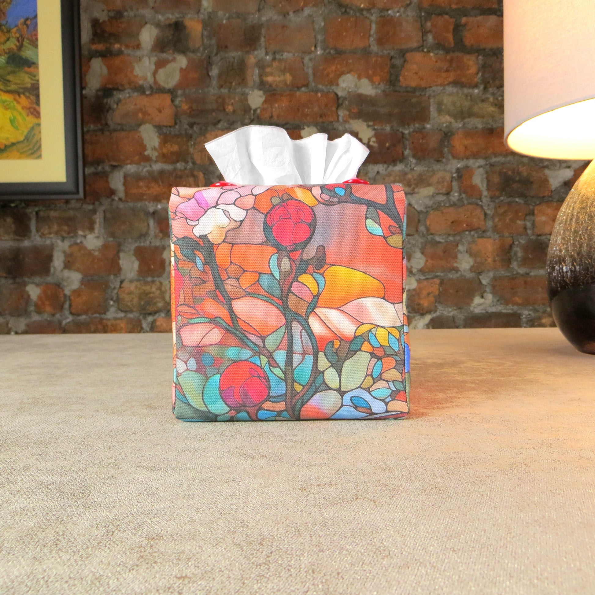 Square tissue box cover with floral garden stained glass design on red toned background