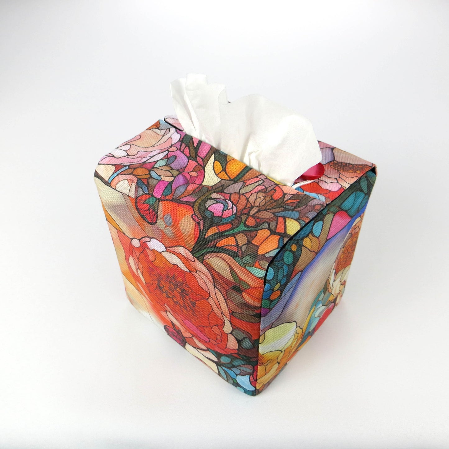 Square tissue box cover with floral garden stained glass design on red toned background