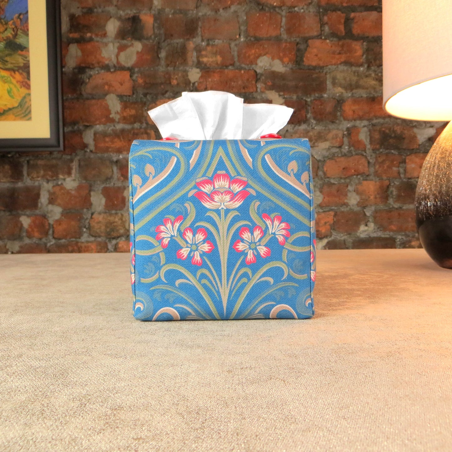 Square tissue box cover with red flowers and green Victorian embellishment on blue background