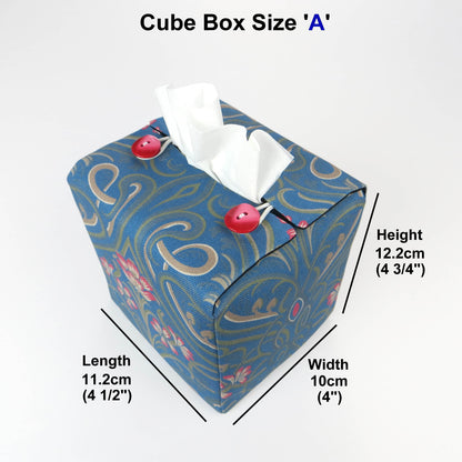 Square tissue box cover with red flowers and green Victorian embellishment on blue background