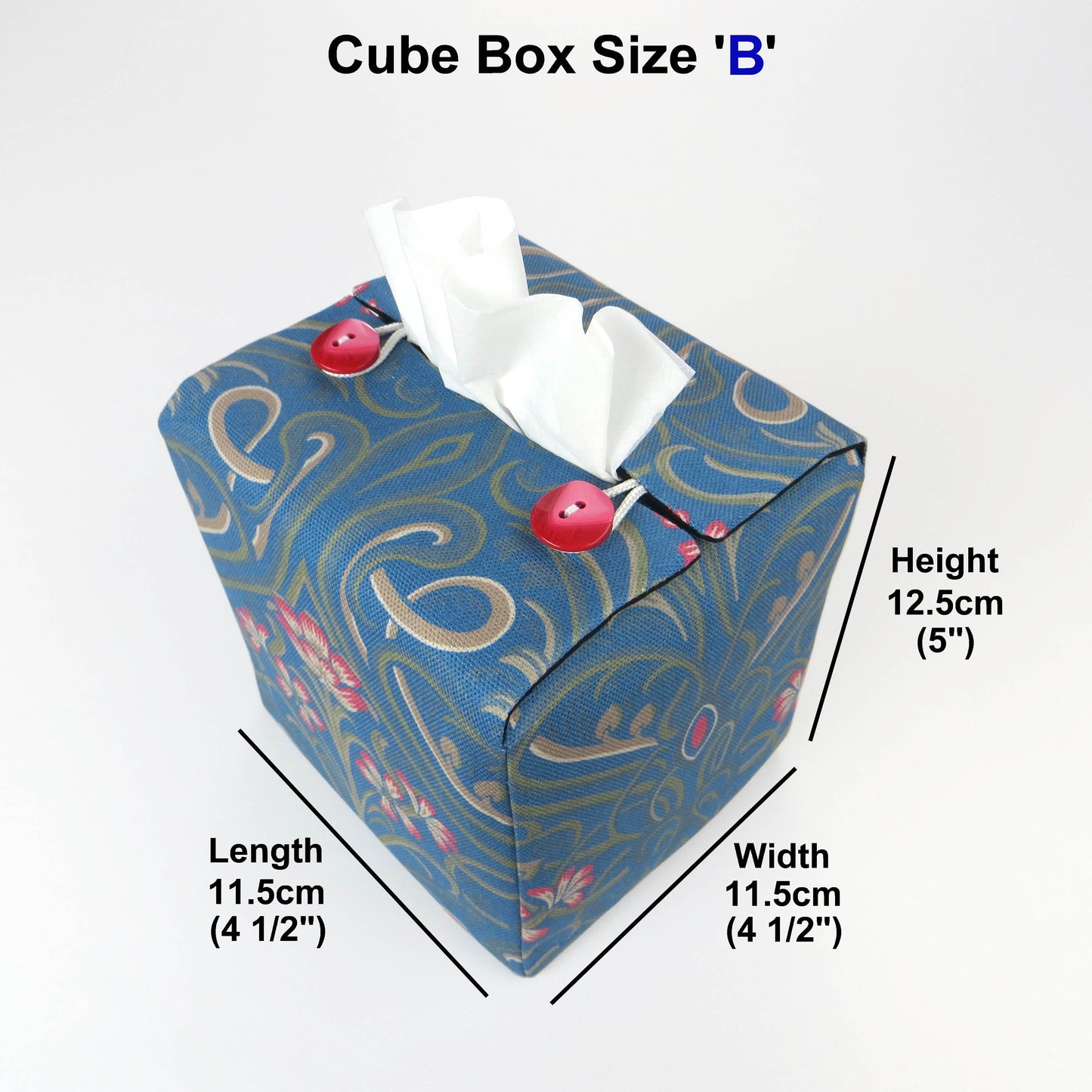 Square tissue box cover with red flowers and green Victorian embellishment on blue background